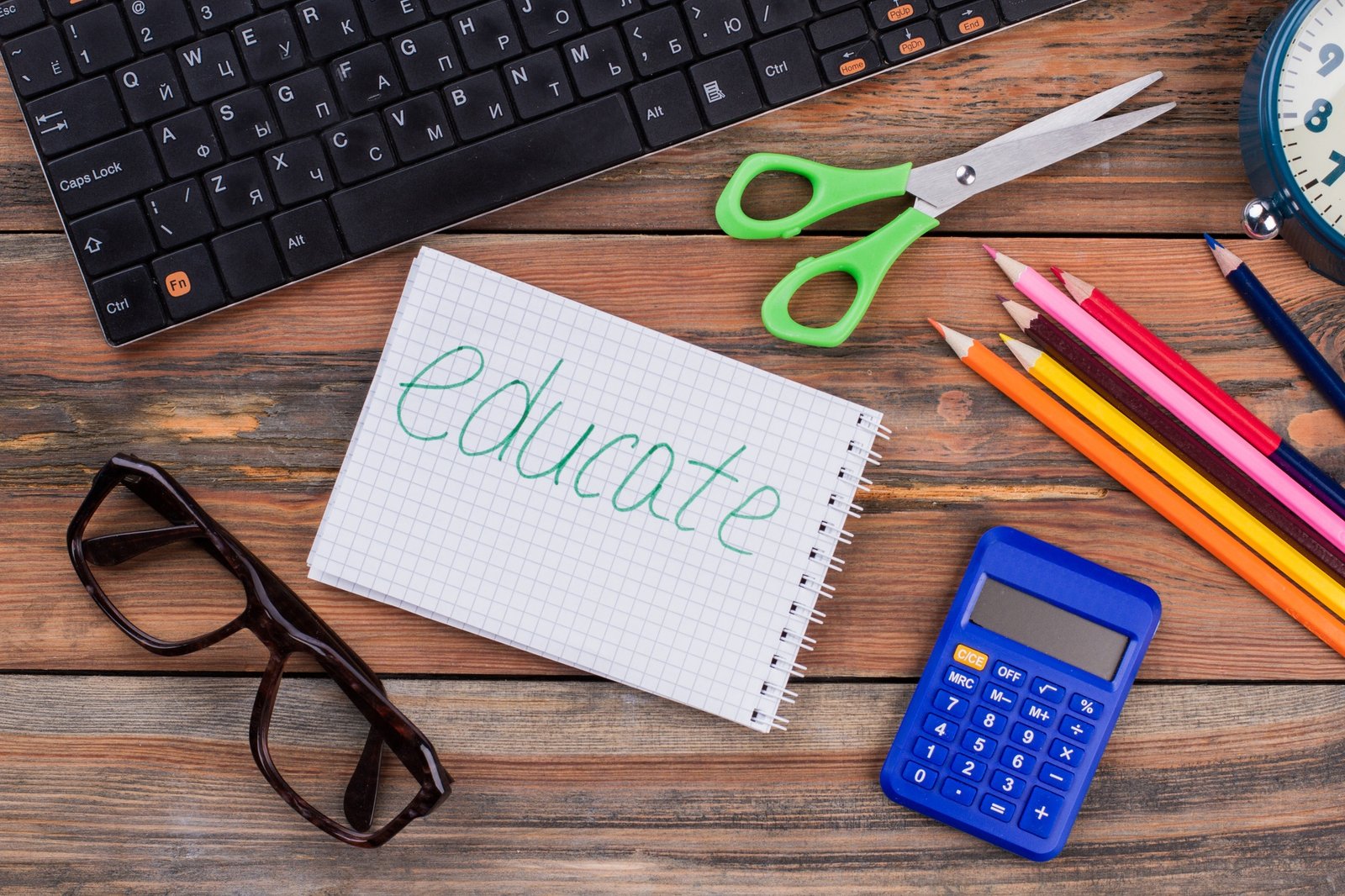 Educate accessories on a wooden desk.